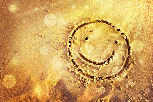 Smiley in het zand