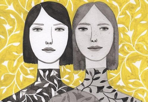 Een tweeling waarvan een in het grijs en een in het zwart gekleed is