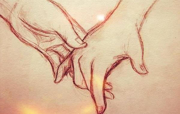 Twee getekende handen die elkaar aanraken want liefde is samen willen zijn