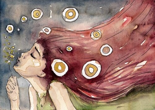 Een meisje met rood haar dat een paardenbloem wegblaast