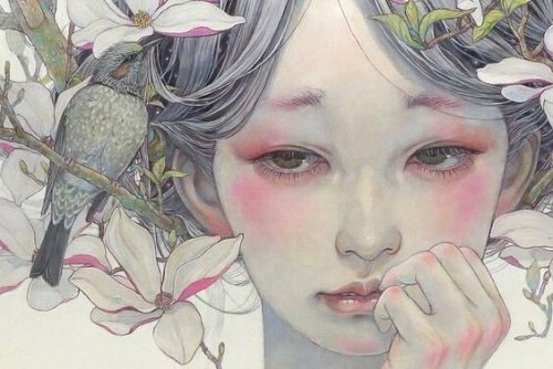 Meisje met bloemen in haar haar dat zeer droevig kijkt omdat ze last heeft van emotionele afhankelijkheid