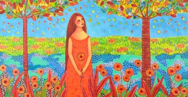 Vrouw in een bloemenveld die geniet van de overvloed in haar leven