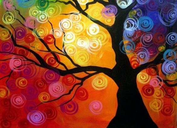 Zwarte boom tegen een kleurrijke achtergrond