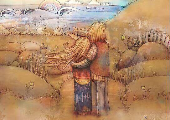 Twee mensen kijken samen naar de golven