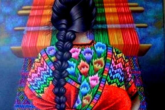 Vrouw die een kleurrijk tapijt weeft