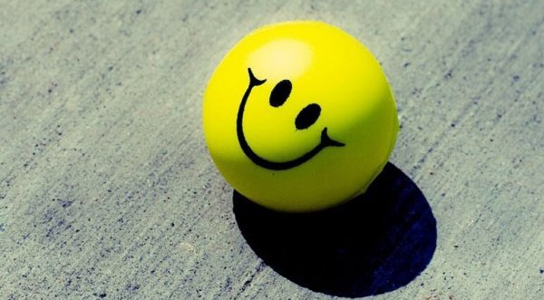 Een smiley die zorgt voor een positieve houding