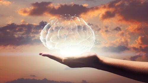 De hersenen verlicht in een open hand