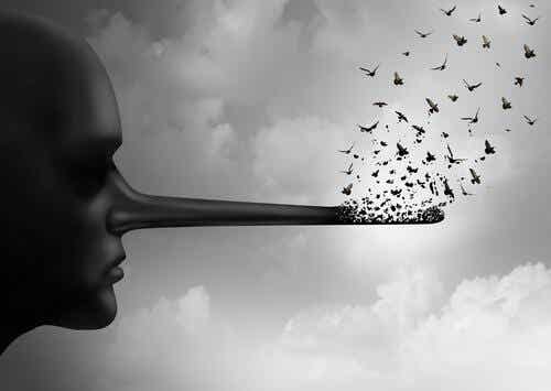 Een persoon met een lange neus waaruit vogels vliegen